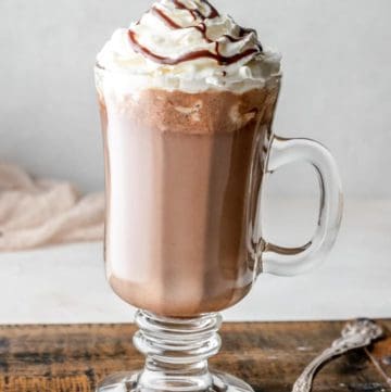 homemade Starbucks hot chocolate topped with whipped cream and chocolate syrup.