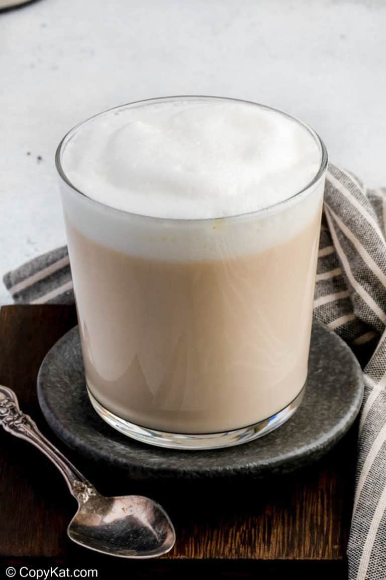 Homemade Starbucks London Fog Earl Grey Tea Latte and a spoon.