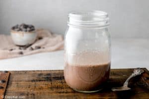 chocolate ganache and milk mixture in a glass jar.