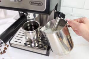 steaming milk with an espresso machine steamer.