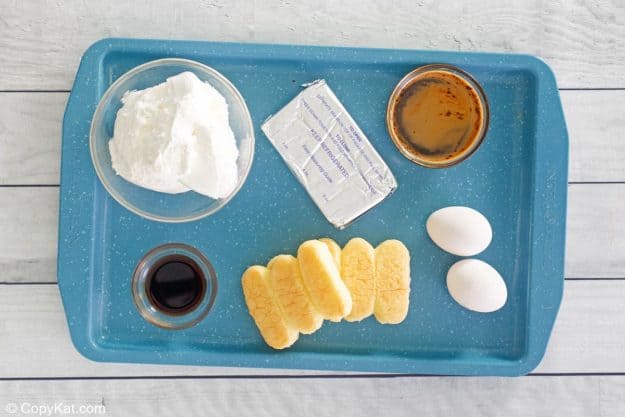 tiramisu cheesecake ingredients on a tray.