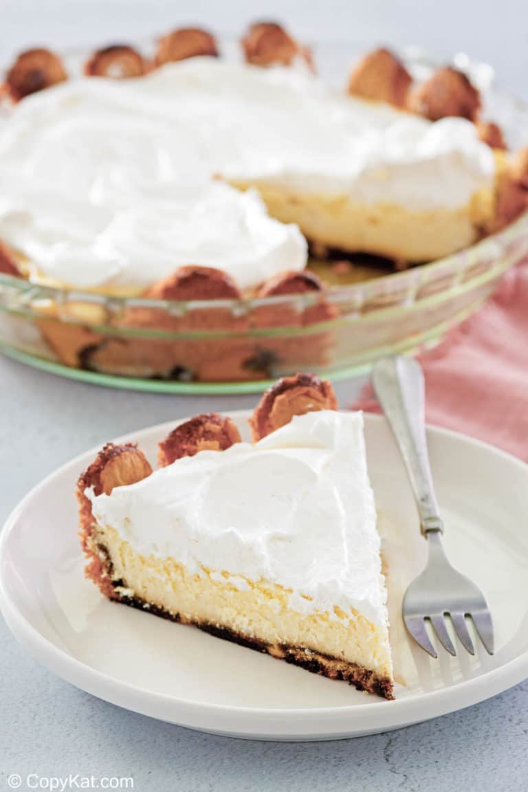 tiramisu cheesecake in a pie plate and a slice on a plate.