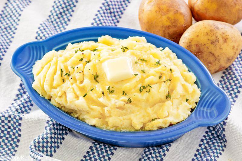 yukon gold mashed potatoes with butter and three potatoes.