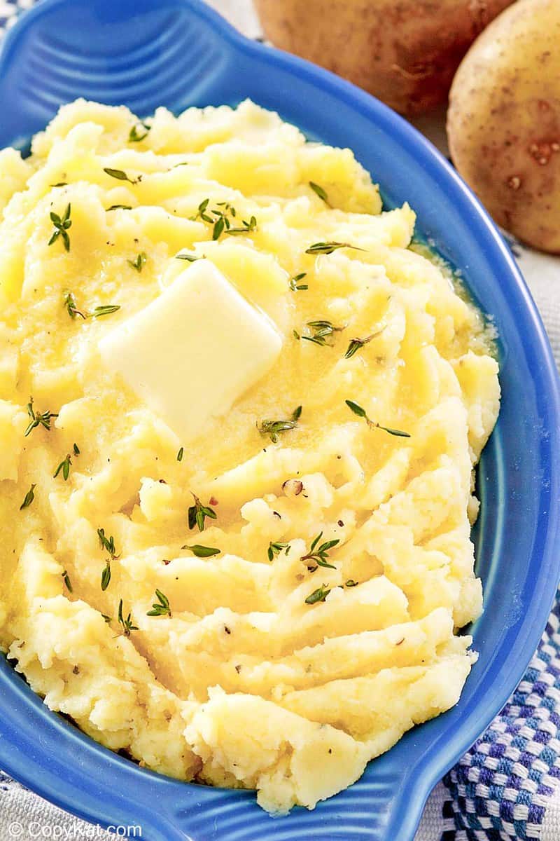 yukon gold mashed potatoes with a pat of butter on top.