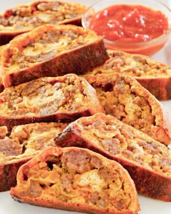 sausage roll slices and picante sauce.