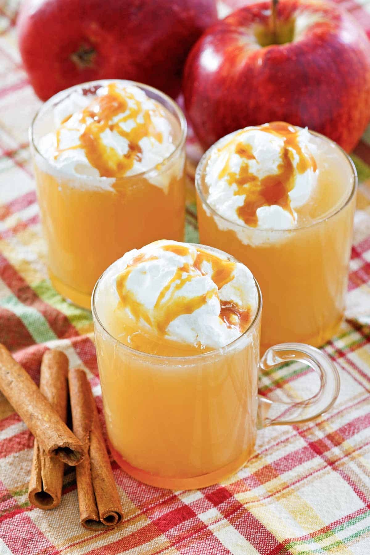 Hot apple cinnamon caramel drink with whipped cream.