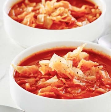 two bowls of homemade cabbage soup.