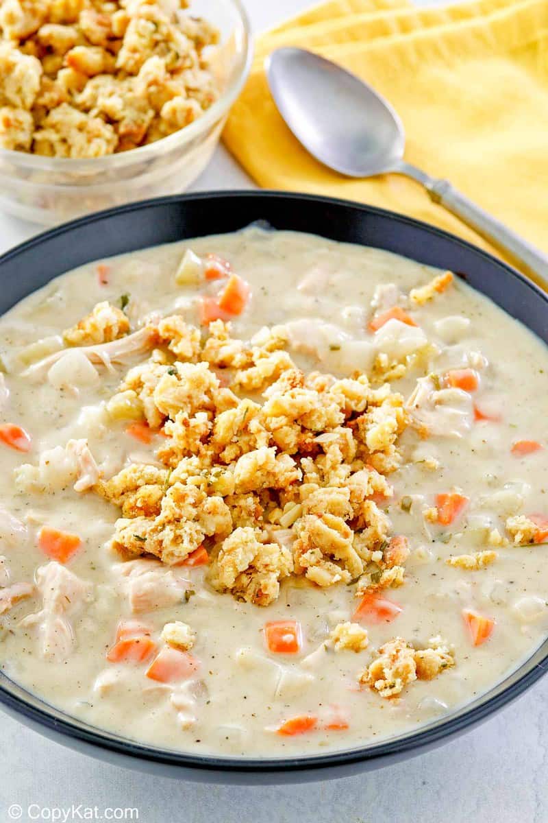 creamy turkey soup topped with stuffing in a bowl.