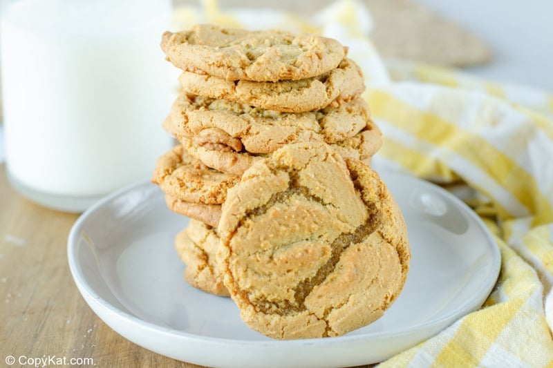 homemade ginger snaps stacked on a plate.