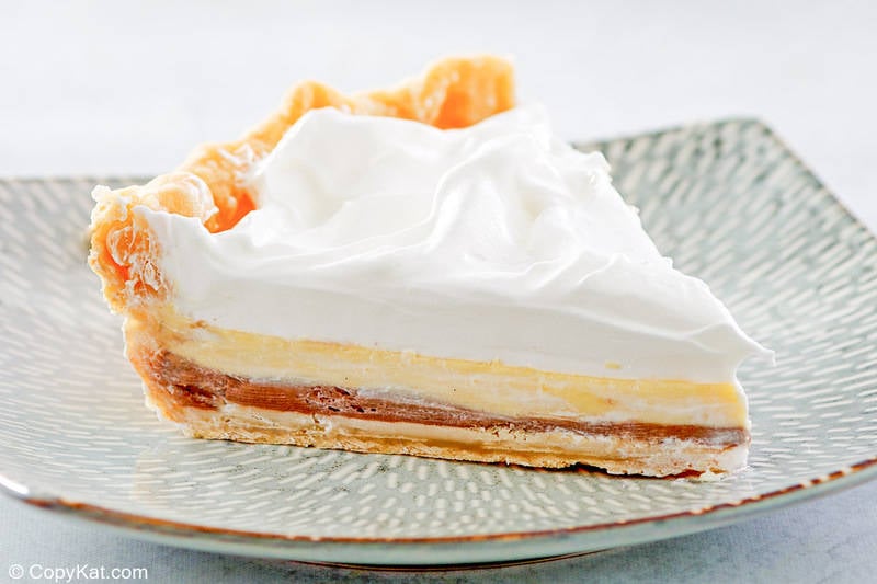 slice of homemade Marie Callender's black bottom pie on a plate.