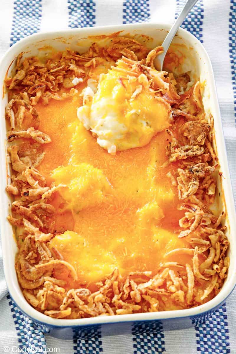 mashed potato casserole with cheese and crispy fried onions on top.