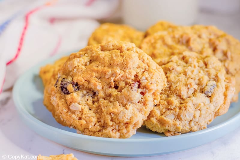 oatmeal raisin cookies on a small blue plate.