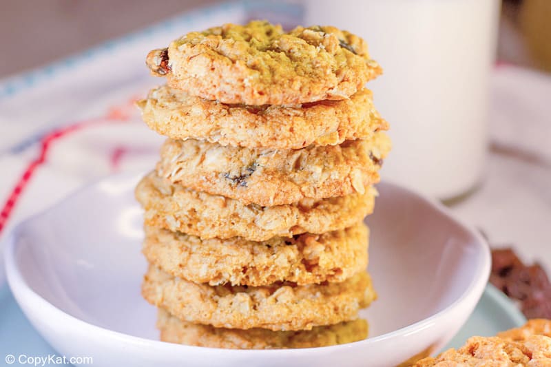 oatmeal raisin cookies stacked in a small bowl.