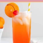 homemade Olive Garden Venetian Sunset drink garnished with orange and a cherry.