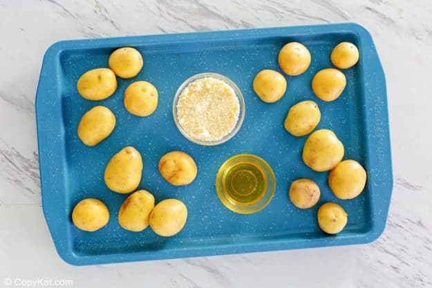 parmesan potatoes ingredients on a tray.