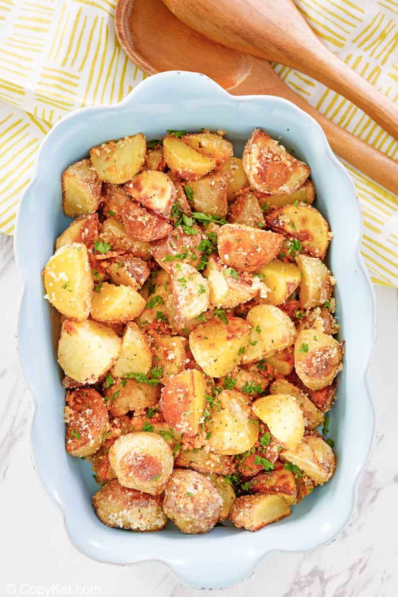 overhead view of parmesan potatoes in a serving dish.