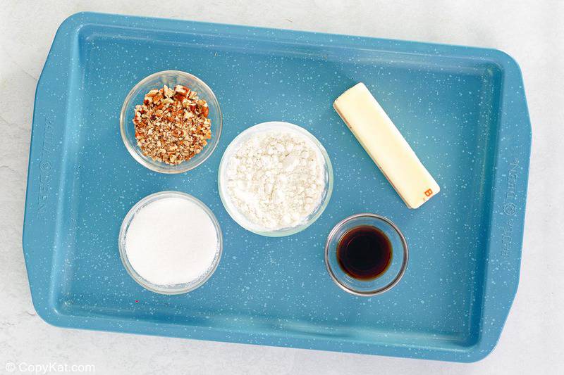 pecan sandies cookies ingredients on a tray.