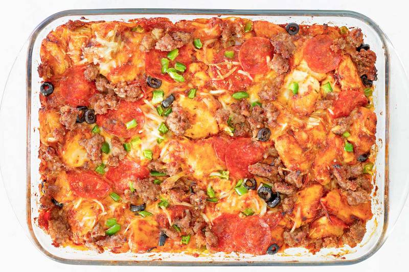 pizza monkey bread with pepperoni and other toppings.