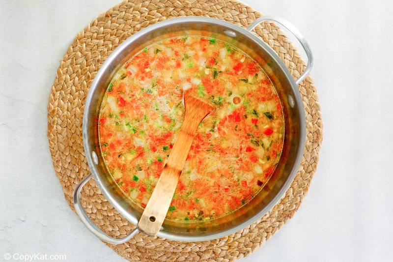 cooked vegetables added to stock for white chicken chili.