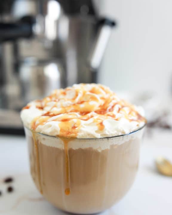 homemade Starbucks caramel latte in a glass mug.