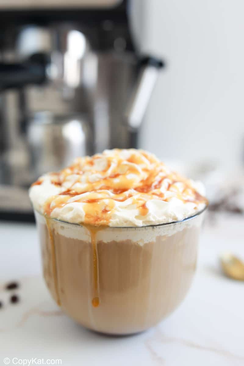 homemade Starbucks caramel latte in a glass mug.
