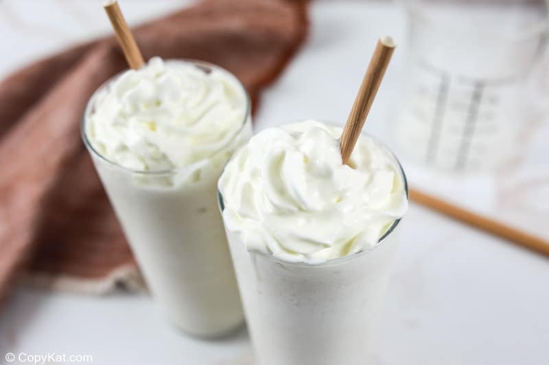 homemade Starbucks vanilla bean frappuccino drinks with brown straws in them.