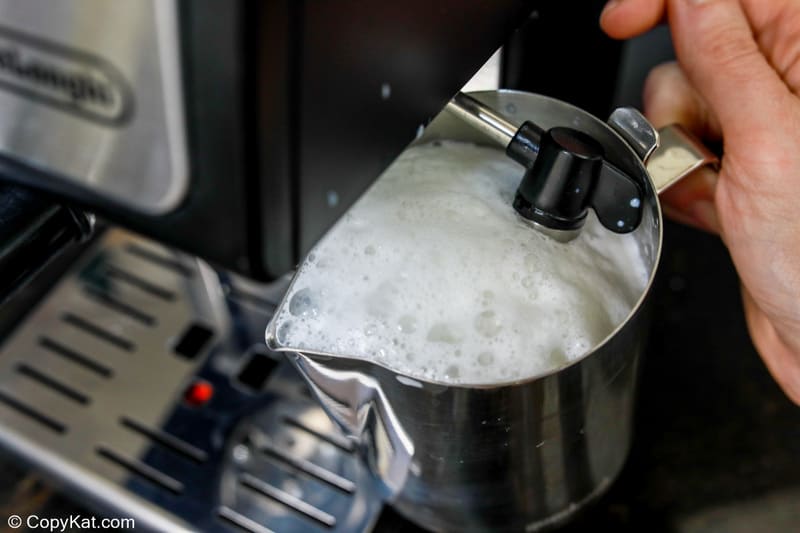 steaming and frothing milk with an espresso machine.