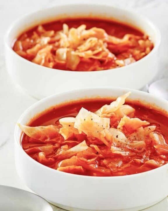 two bowls of homemade cabbage soup.