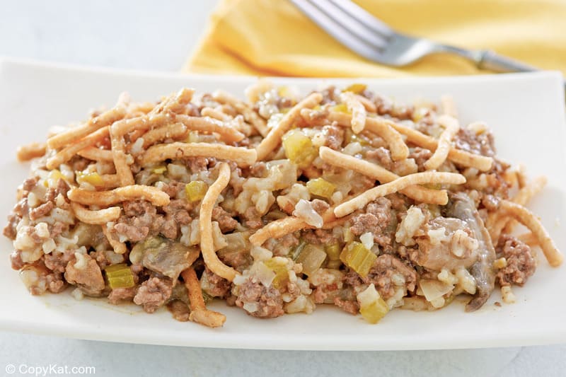 American chop suey serving on a plate and a fork.