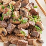 hibachi steak and mushrooms on a platter.