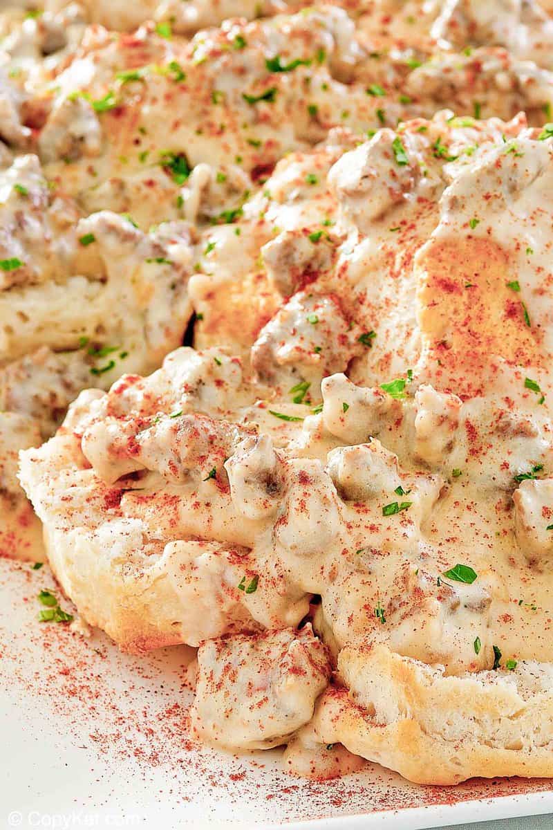 closeup of homemade Bob Evans sausage gravy and biscuits.