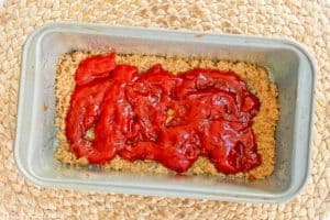 brown sugar and ketchup in the bottom of a loaf pan.