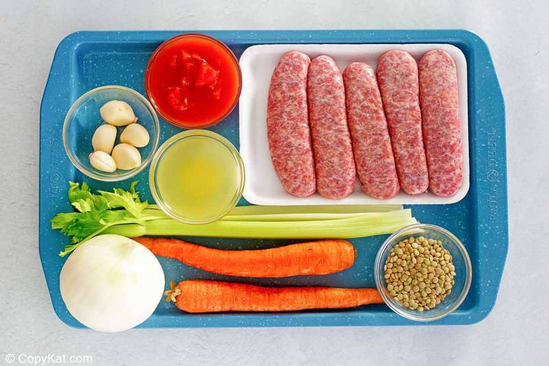 Carrabba's sausage lentil crockery   ingredients connected  a tray.