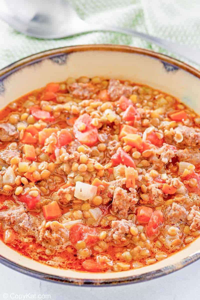 https://copykat.com/wp-content/uploads/2022/01/Carrabbas-Sausage-Lentil-Soup-Pin-2.jpg