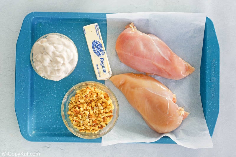 chicken and dressing casserole ingredients on a tray.