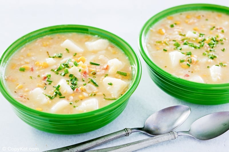 potato corn chowder in two bowls and two spoons.