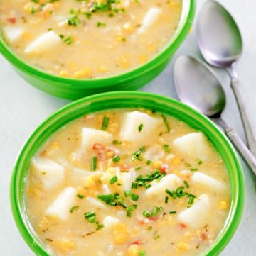 two bowls of corn chowder with potatoes.