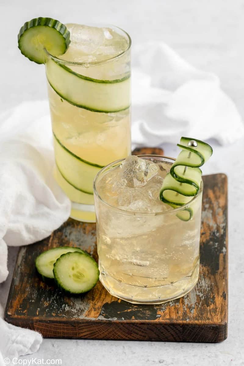 two fleur de lis cucumber gin cocktail drinks.