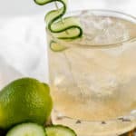 fleur de lis cucumber gin cocktail in a rocks glass.
