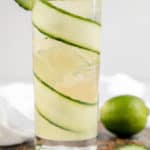 fleur de lis cucumber gin cocktail in a tall glass.