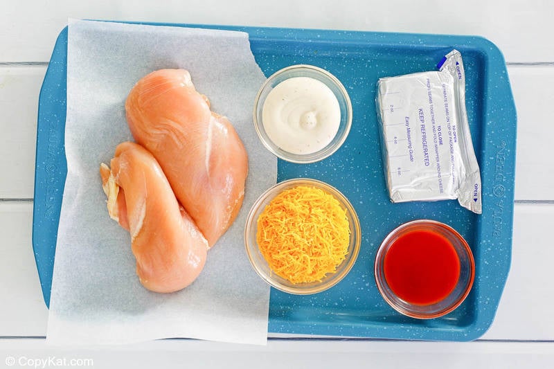 Frank's Buffalo chicken dip ingredients on a tray.