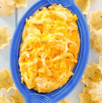 overhead view of Frank's Buffalo chicken dip in a dish and tortilla chips around it.