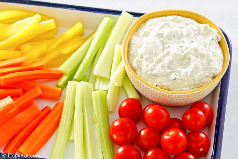 green goddess dip and vegetables on a tray.