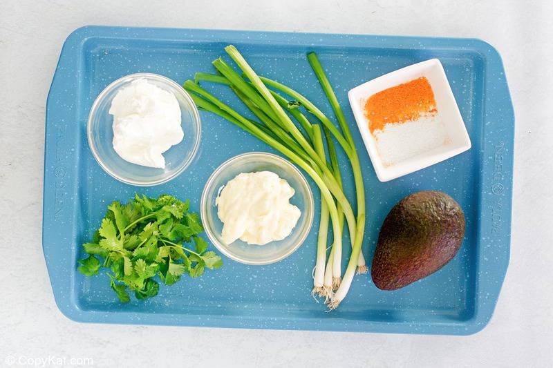 green goddess dip ingredients on a tray.