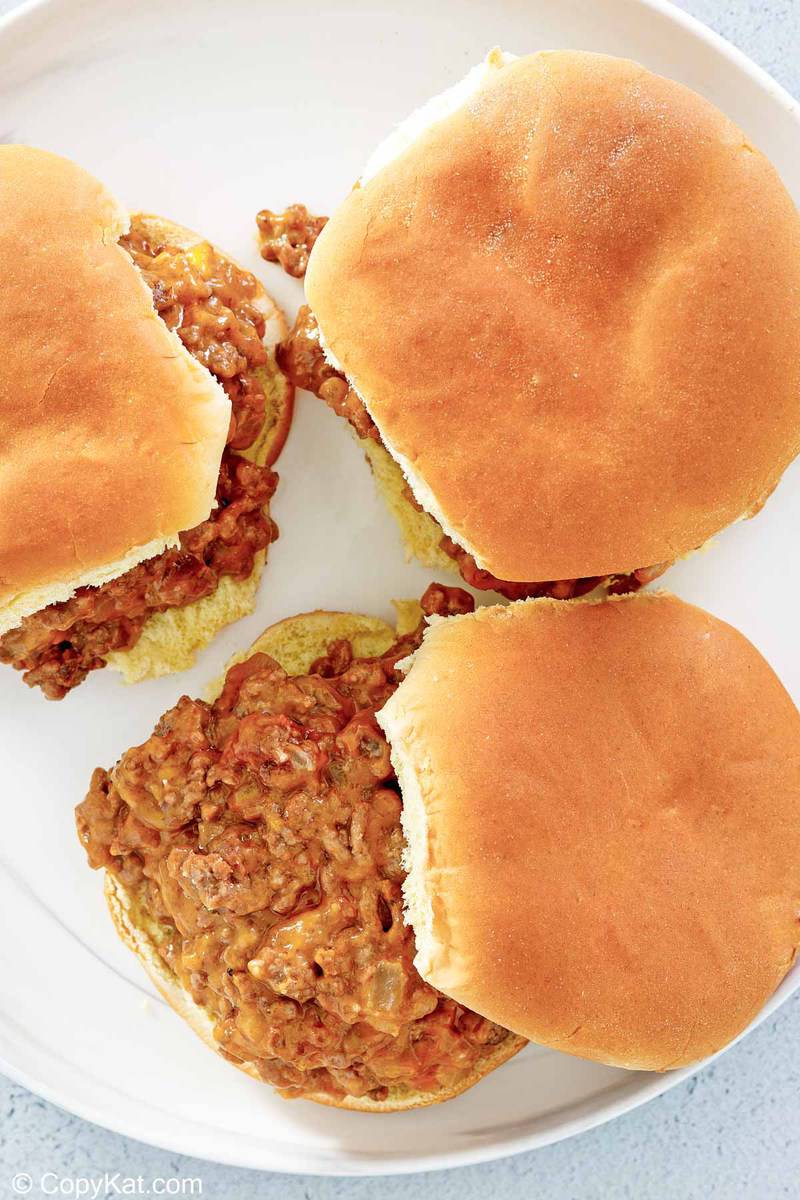 overhead view of loose meat sandwiches on a plate.