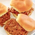 loose meat sandwiches on a white plate.