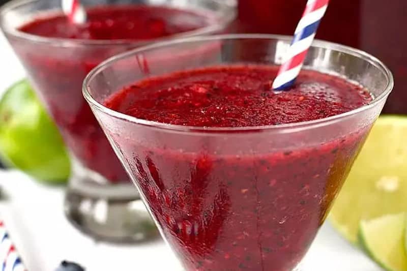 mixed berry rum slushies in martini glasses.