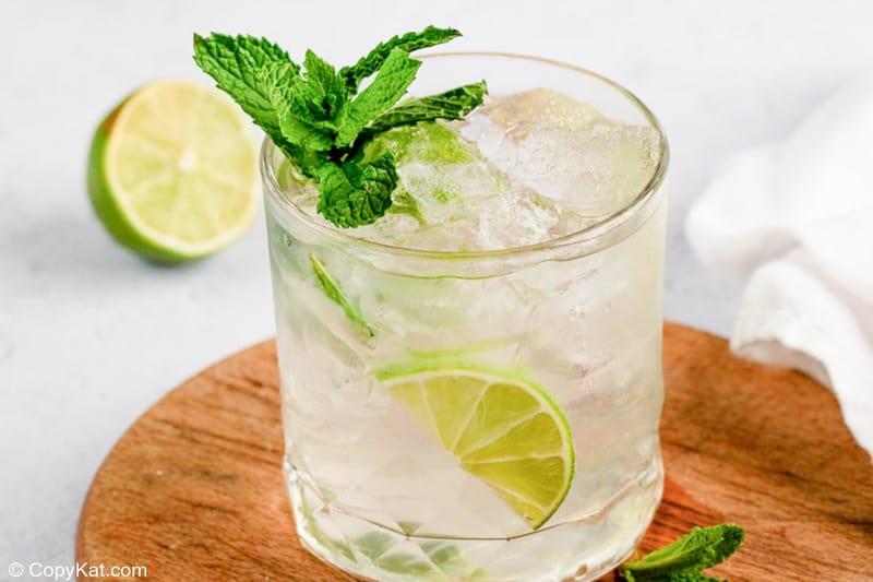 mojito drink garnished with fresh mint.