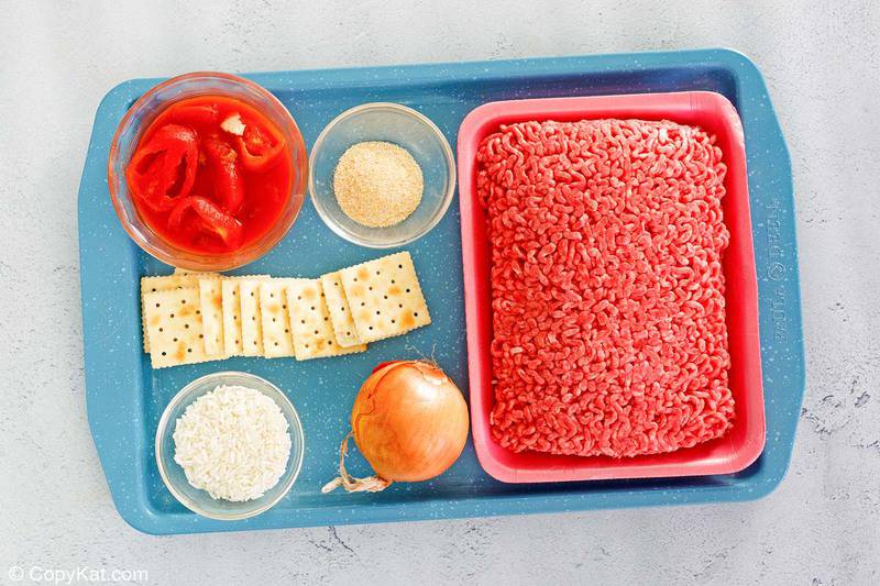 porcupine meatballs ingredients on a tray.