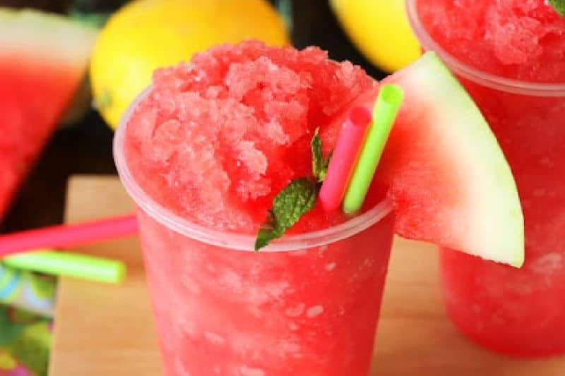 watermelon rum slush garnished with watermelon slice.